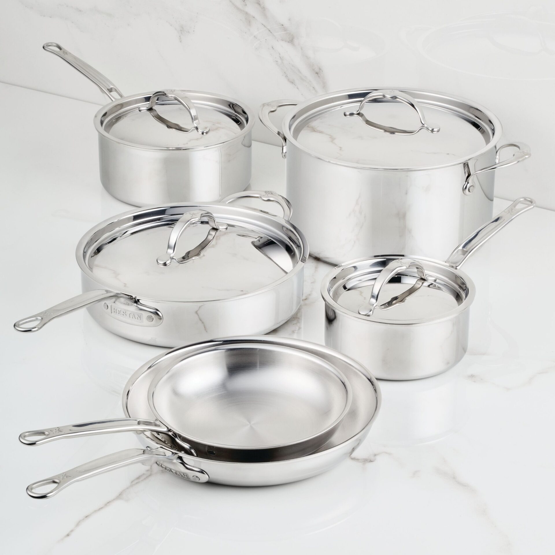 Hestan ProBond professional clad stainless steel cookware stack, featuring molecular-tier engineering for high-heat searing.